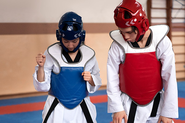 people-practicing-taekwondo-gymnasium